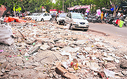 Debris dumped along a road at Shastri Market in Sector 22, Chandigarh. The road has not been cleaned up for months