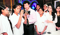 Slumchildren look at a camera at the inaguration of a summer workshop at International School of Media in Sector 38, Chandigarh, on Friday