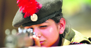 NCC cadet sharpens her shooting skill during an annual training camp organised on the premises of the Khalsa College for Women