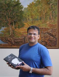 Jerry Pinto with his book Em and the Big Hoom 