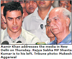 Aamir Khan addresses the media in New Delhi on Thursday. Rajya Sabha MP Shanta Kumar is to his left. Tribune photo: Mukesh Aggarwal