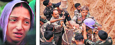 Wailing mother of Maahi. Army, administrative and health officials during the rescue operations at Khoh village near Manesar in Gurgaon district. 