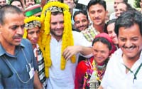 AICC general secretary Rahul Gandhi with a dance troupe in Kullu on Monday