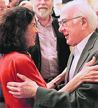 British physicist Peter Higgs (R) congratulates Fabiola Gianotti, the ATLAS experiment spokesperson