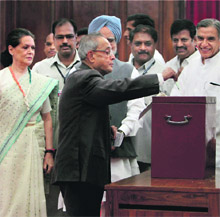 UPA presidential candidate Pranab Mukherjee casts his vote in New Delhi on Thursday.