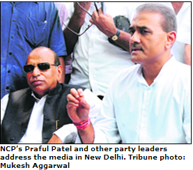 NCPs Praful Patel and other party leaders address the media in New Delhi.