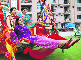 Festive time: Women celebrate Teej at a housing society in Sector 20, Panchkula, on Sunday.