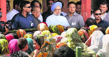 Prime Minister Manmohan Singh interacts with riot-hit people at a relief camp in Kokrajhar district on Saturday