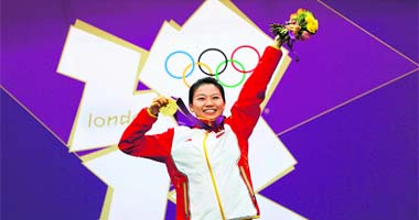 China's Yi Siling holds her gold medal at the victory ceremony after winning the women's 10m air rifle final competition