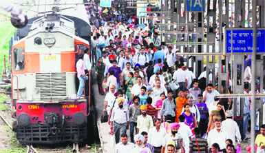 Stranded passengers at the Amritsar railway station on Monday. Photo: Sameer Sehgal