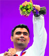 Gagan Narang celebrates after winning the bronze in the 10m Air Rifle shooting event.  PTI 