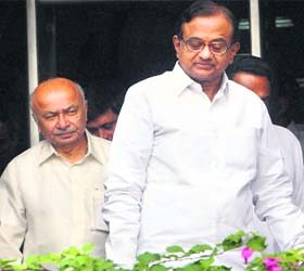 Union Ministers P Chidambaram (R) and Sushil Kumar Shinde come out after attending a meeting at Krishi Bhavan in New Delhi on Tuesday