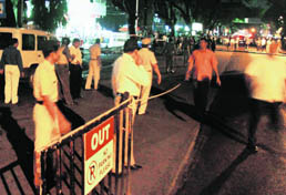 Policemen cordon off an area after a blast in Pune on Wednesday.
