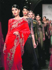 Models display creations of designer Varun Bahl during the inaugural show of the Delhi Couture Week 2012 in New Delhi