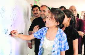 People take part in a signature campaign organised by the Bharatiya Janata Party demanding arrest of politician Gopal Kanda at Sector 17 in Chandigarh on Friday.