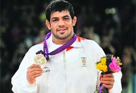 Sushil Kumar with the silver medal in 66kg wrestling