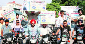 Fans take out a rally in support of Indian Idol contestant, Devinder Pal Singh in Ludhiana.