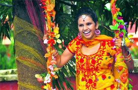 A girl participates in Teej celebrations at the KIMT College in Ludhiana.