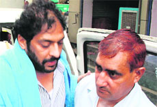 Former Haryana minister Gopal Kanda in Gurgaon, brought by Delhi police investigators on Sunday.
