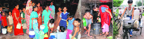 Women and children queue up for their turn to fill their buckets and containers at a tap at Hallo Majra village in Chandigarh.