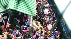 People from North-Eastern states crowd Guwahati railway station after disembarking from a train  from Bangalore, on Monday.  PTI 