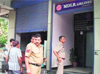 A Delhi Police team at the MDLR office in Gurgaon on Monday. 