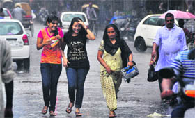 Girls have a good time as it rains in Ludhiana.