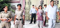 A Delhi Police team comes out after conducting a search at Gopal Kandas Gurgaon residence on Wednesday.  PTI
