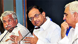 Union Ministers P Chidambaram, Sriprakash Jaiswal and Salman Khurshid at a press meet in New Delhi