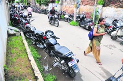 Students of GGN Khalsa College park their two-wheelers haphazardly on either side of Sham Singh Road, Ludhiana, inconveniencing residents. tribune photo: himanshu mahajan