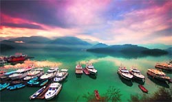 The aquamarine Sun Moon Lake in the centre of the island, ringed by green hills, is like a magical lost land, straight out of a fairytale