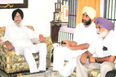 Sanjha Morcha leaders Surjit Singh Barnala (black turban) and Manpreet Singh Badal (white turban) at a meeting in Chandigarh on Tuesday.