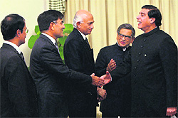 External Affairs Minister S M Krishna introduces his delegation to Pakistan Prime Minister Raja Pervez Ashraf at a meeting in Islamabad on Friday
