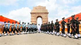 Members of an inter-services guard of honour march past India Gate in New Delhi after a homage-paying ceremony