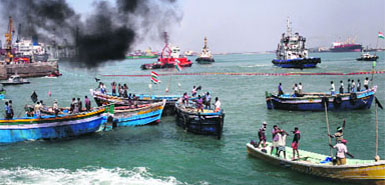 Fishermen attempt to blockade the port in their fishing boats in protest against the commissioning of the Kudankulam Nuclear Power plant, in Tuticorin on Saturday. - AFP 