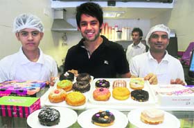 American delight: Ketan Kalra (in black) offers a variety of donuts