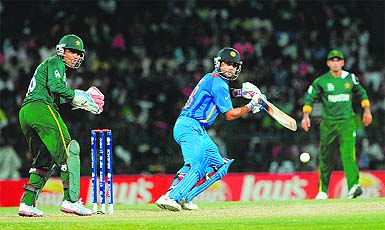 Virat Kohli plays a shot during the ICC Twenty20 Cricket World Cup match against Pakistan in Colombo on Sunday. Kohlis unbeaten 78 off 61 balls guided India to an emphatic eight-wicket victory, keeping its chances alive in the tournament . 