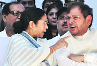 TMC supremo Mamata Banerjee with JD(U) chief Sharad Yadav in New Delhi. Tribune photo: Mukesh Aggarwal