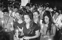 Kingfisher Airline staff take out a candlelight march to mourn the suicide of their colleague's wife and push for release of their salaries in New Delhi on Friday. Tribune photo: Manas Ranjan Bhui