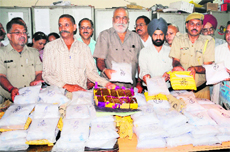 Customs officials show the contraband seized from a goods train coming from Pakistan. 