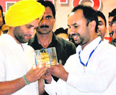 AICC general secretary Rahul Gandhi gets a replica of the Golden Temple during his visit to Amritsar.