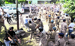 The police lathi-charge BJP and Congress workers after they clashed for the possession of property in the Race Course locality in Dehradun on Thursday