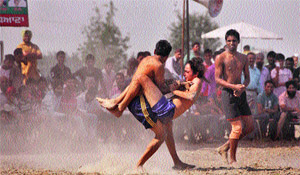 A match in progress on the opening day of the first Kabbadi Cup at Dhari village in Ludhiana on Friday.