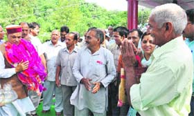 Chief Minister PK Dhumal is greeted during an election meeting in the Sujanpur constituency on Monday