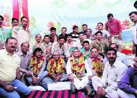 Gandharav Singh with Kuldip Singh Pathania and supporters at Chowari in Chamba on Sunday evening