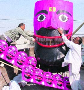 Craftsmen prepare an effigy of Ravana at Fatehgarh Mohalla near Daresi ground in Ludhiana