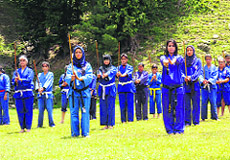 Young girls getting training in Sqay, a traditional martial arts form, in Valley.