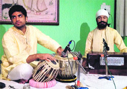 Artistes perform during a musical baithak held at Gurukul Viram in Dehradun on Monday. 