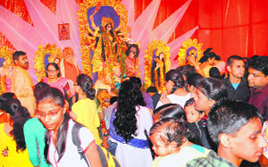 Devotees offer prayers on the occasion of Durga Puja at the Banga Bhawan, Sector 35, Chandigarh, on Tuesday.