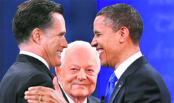 US President Barack Obama (R) and Republican presidential nominee Mitt Romney at the final presidential debate in Florida. Also seen is moderator Bob Schieffer.  Reuters